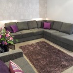 Living room in  muted shades of grey with purple accents